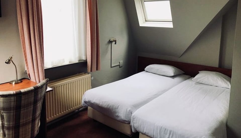 Unit with 2 Single beds. Exact unit will be assigned upon arrival. Views, colors, and decor may vary.