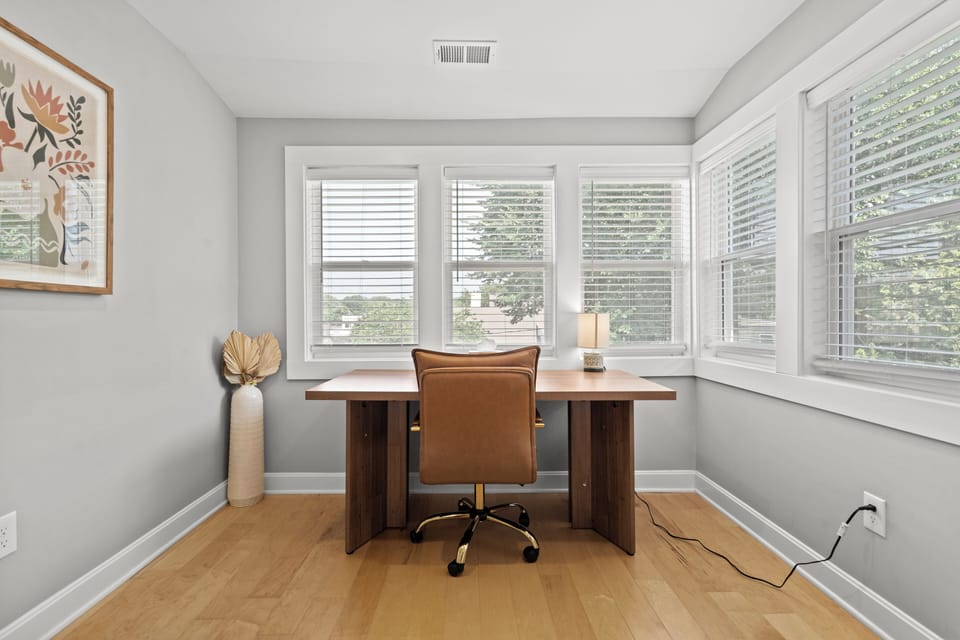 Second floor primary bedroom with sunroom/work space