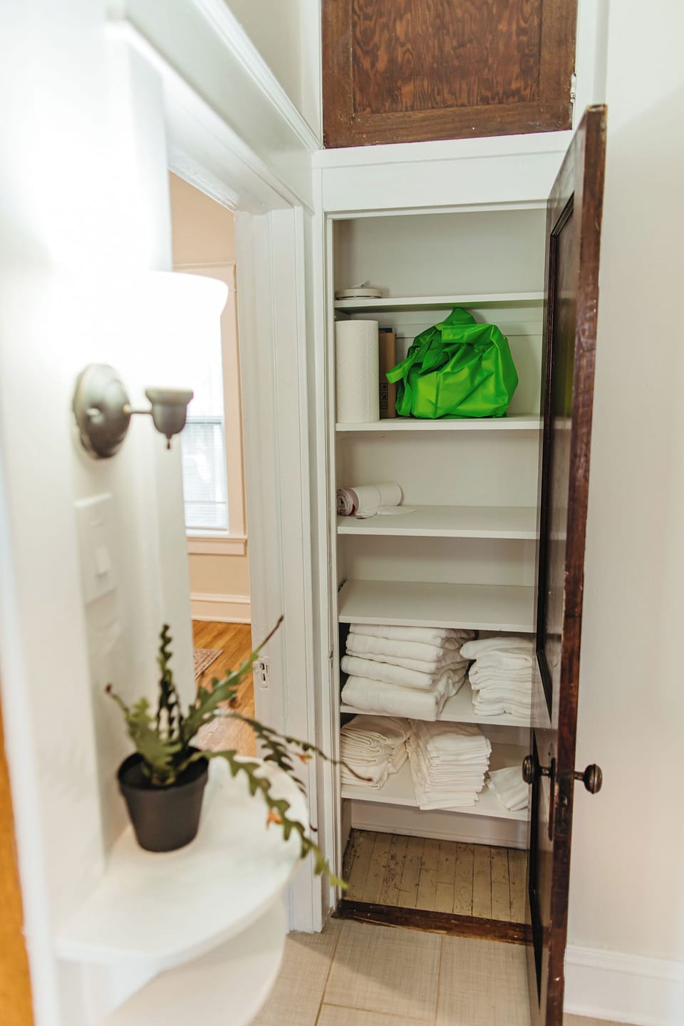 Dedicated linen closet stocked with towels and essentials for comfortable extended stays.