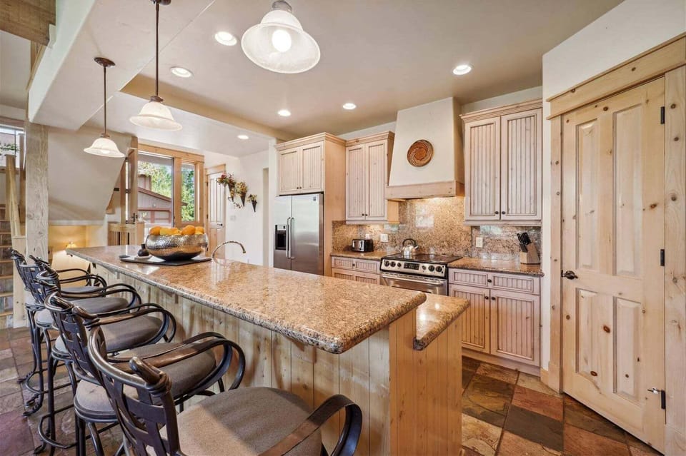 Gourmet Fully Equipped Kitchen with Bar Stools