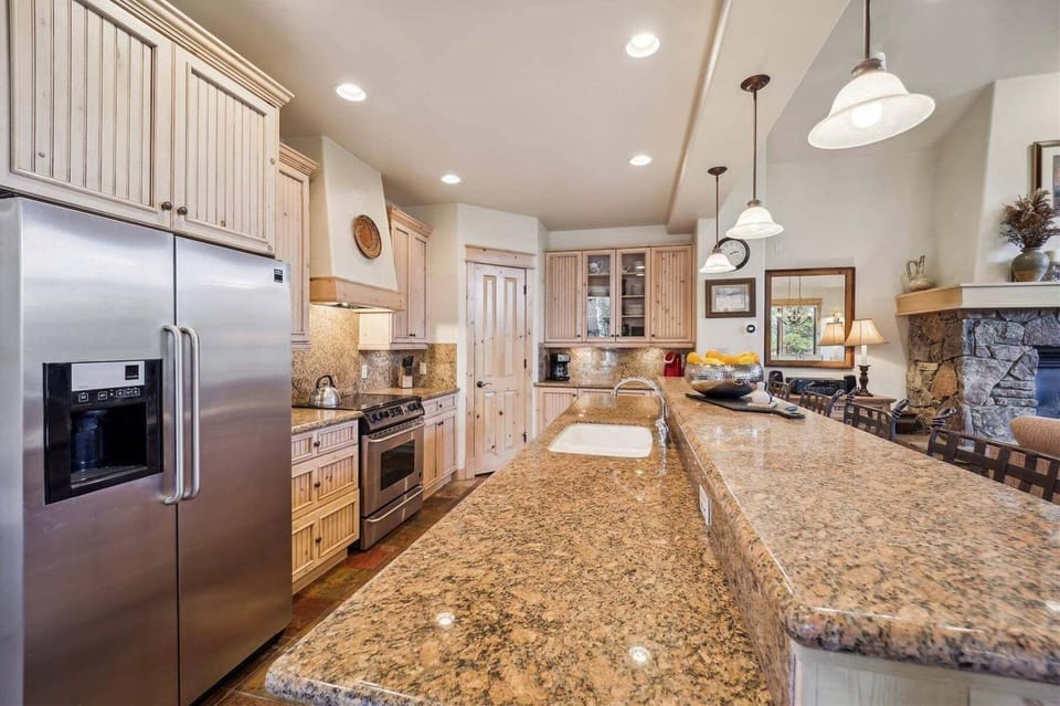 Gourmet Fully Equipped Kitchen with Bar Stools