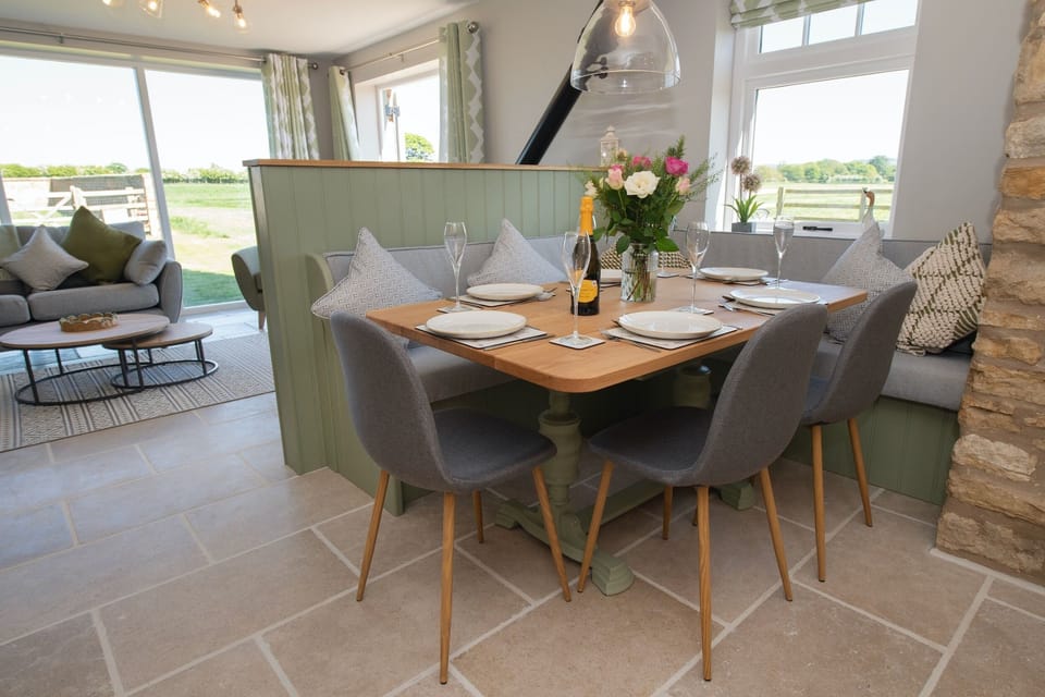 Comfortable booth seating around the oak dining table
