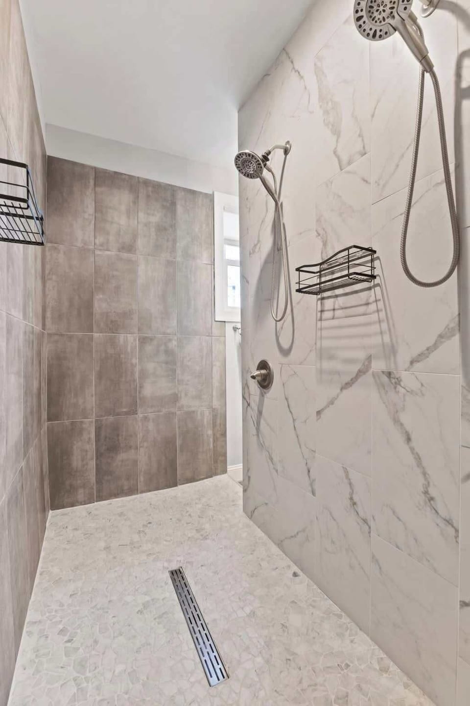 Step into your private sanctuary — this spacious primary bath features a stylish double vanity, modern fixtures, and thoughtful details that create a calm, luxurious space to refresh and unwind.