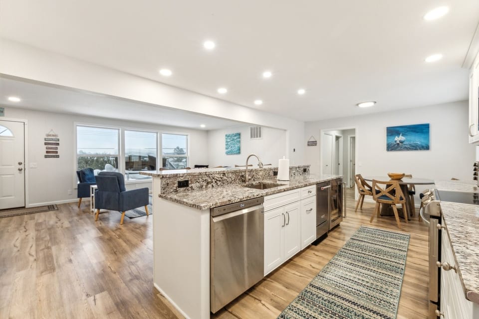 Kitchen including dishwasher, undercounter icemaker and undercounter beverage cooler