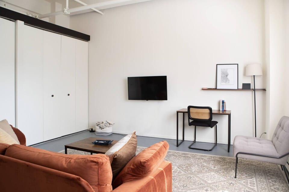 Bright, open-concept living area designed for both relaxation and productivity.