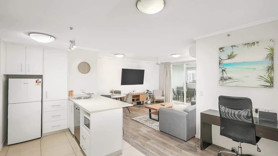A dedicated workspace in the living area offers ample space to set up your laptop and work remotely.
