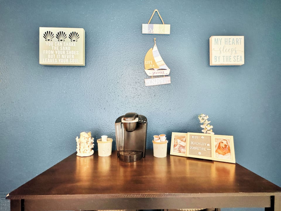 coffee bar with a Keurig coffee maker and 4 stools