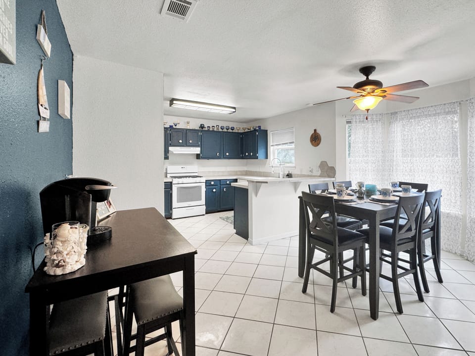 coffee bar and high top table with 10 chairs