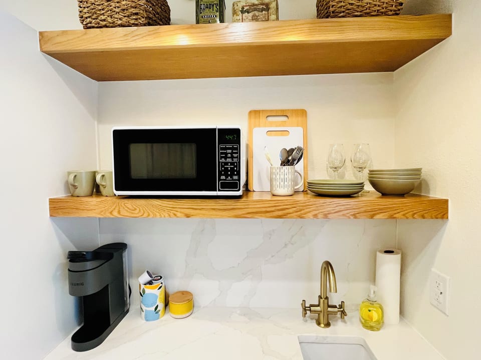 Kitchenette with plates, dishes, silverware
