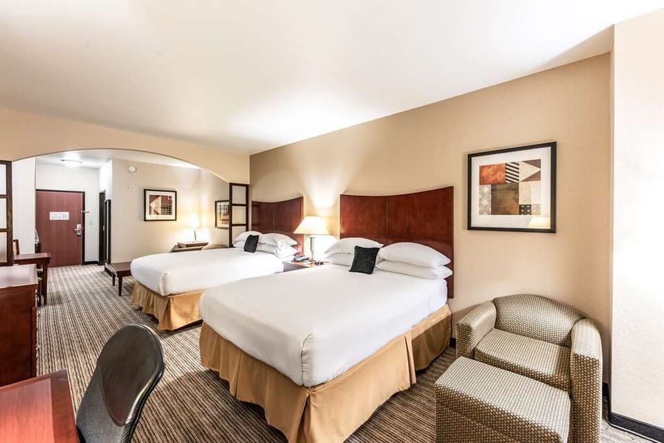 Unwind on crisp linens in a spacious double-queen room.