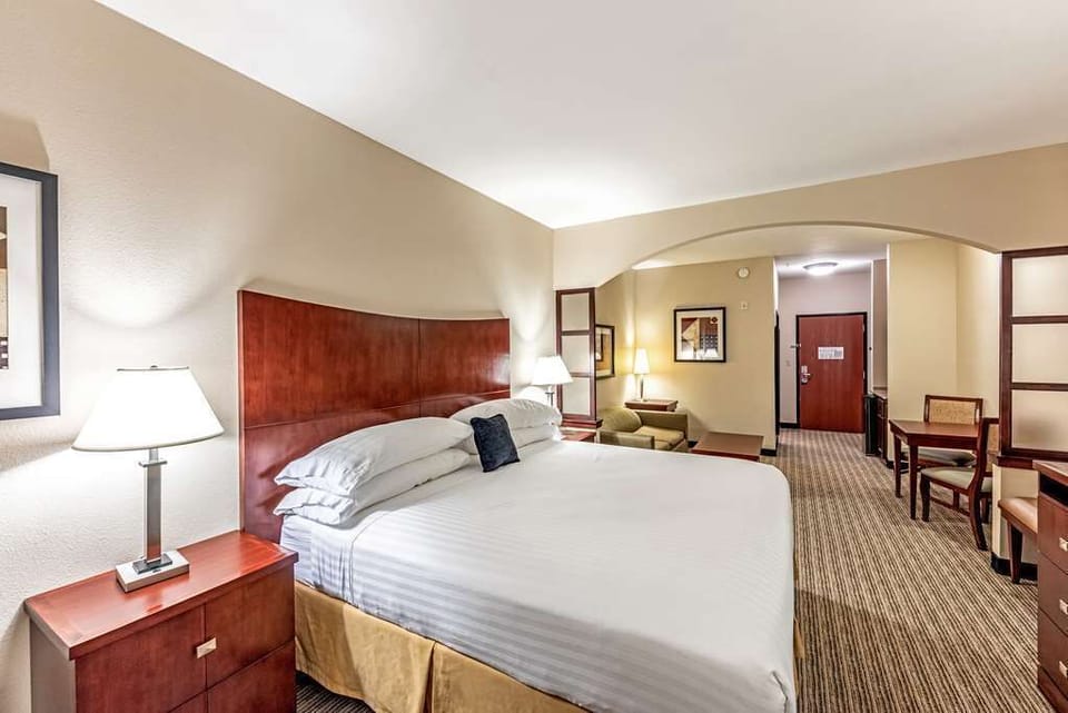 Drift off easily with plush pillows and warm bedside lighting.