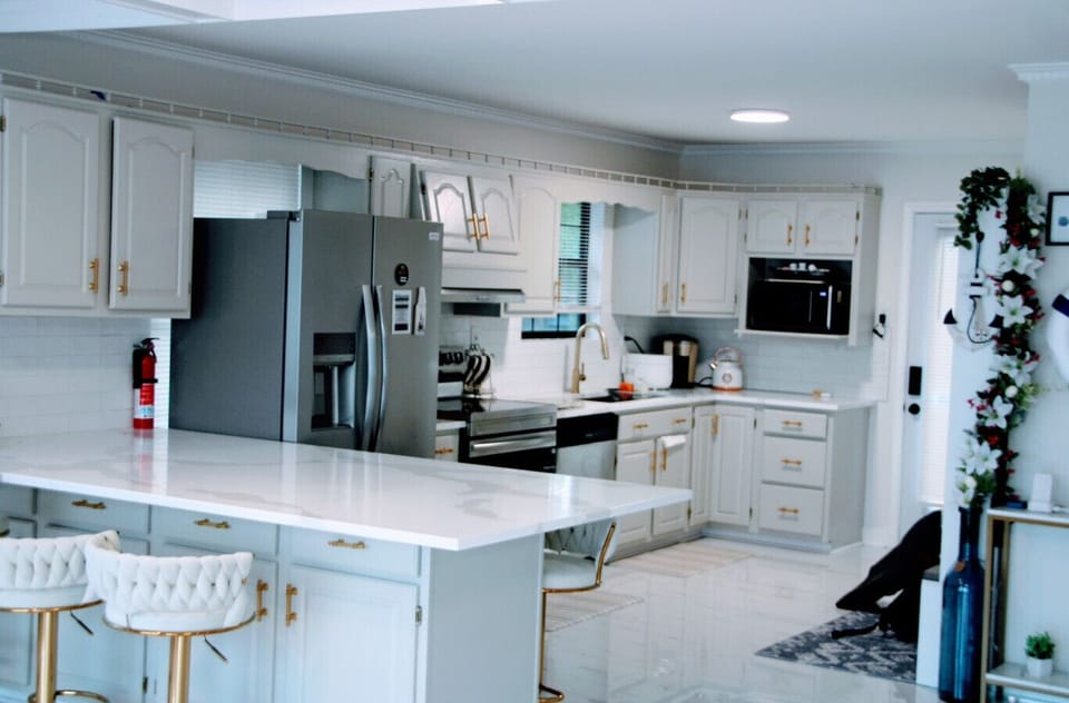 Chef's kitchen on main level with stainless steel appliances