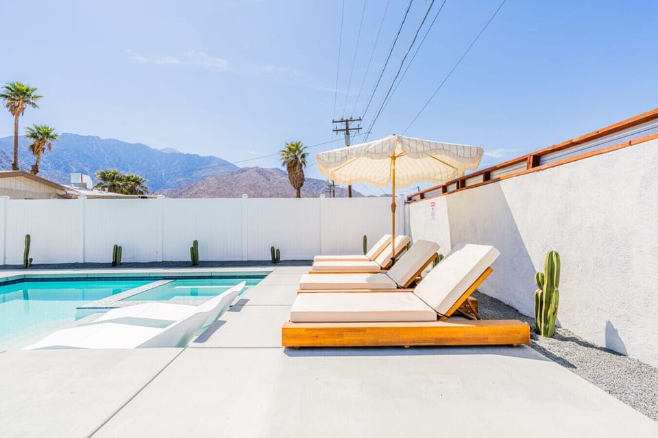 Poolside loungers set for sunbathing, afternoon naps, or unwinding after a swim.