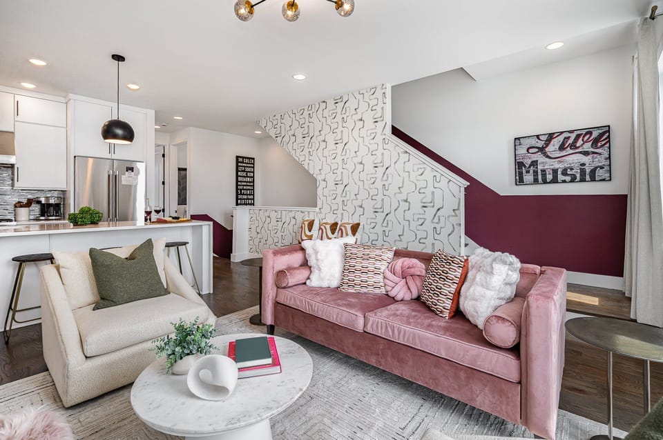 3rd Unit (2nd Floor): Open-floor living space featuring a smart TV and designer furnishings.