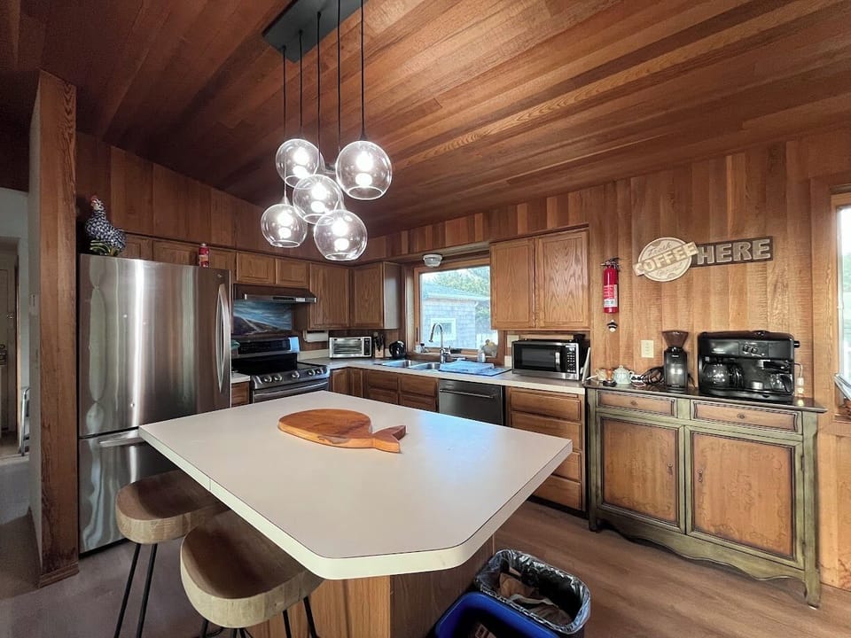 Full size kitchen with island seating. Dishwasher, microwave, stove, fridge etc.