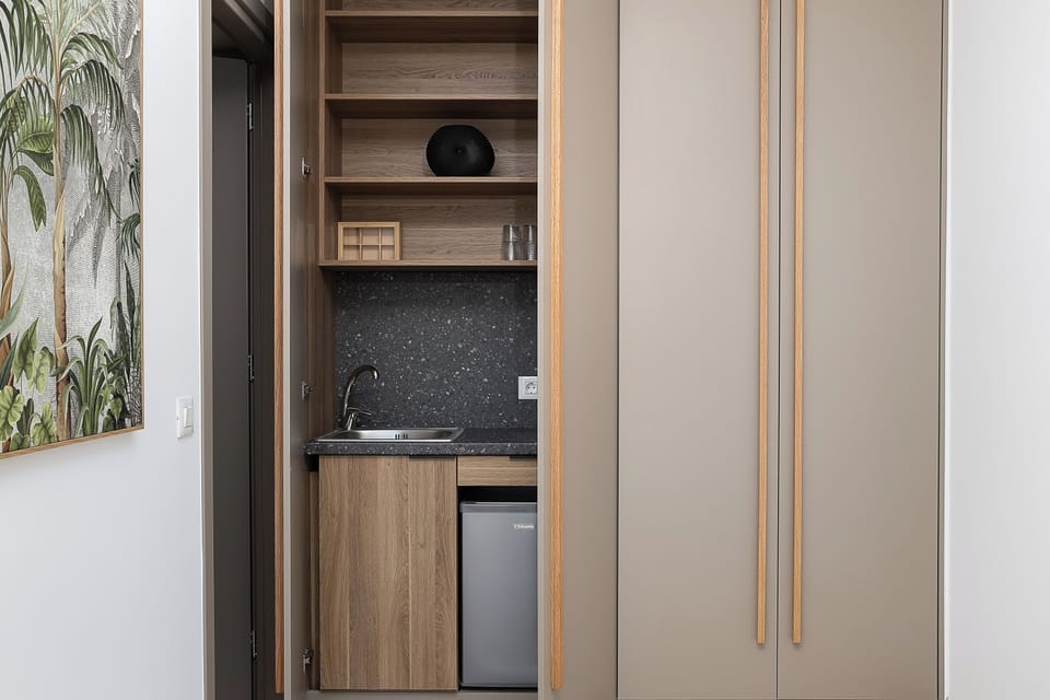 It also features a convenient kitchenette including a mini fridge and an electric kettle.