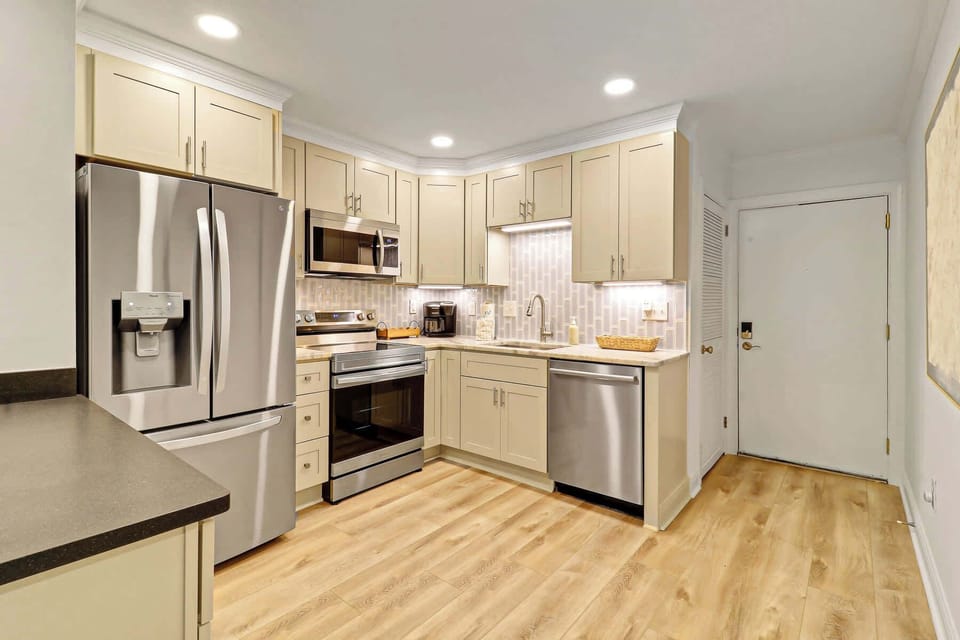 Kitchen fully stocked with cookware and dishware
