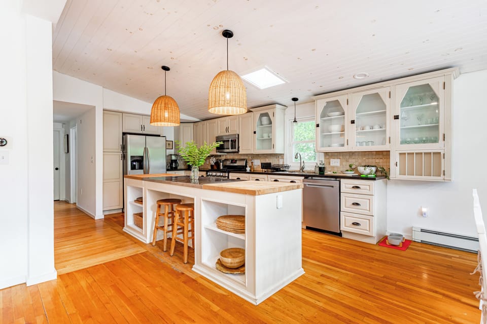 Fully stocked kitchen with loads of space, modern appliances, and a large island for meal prep or gathering. Everything you need to cook and enjoy delicious meals together.