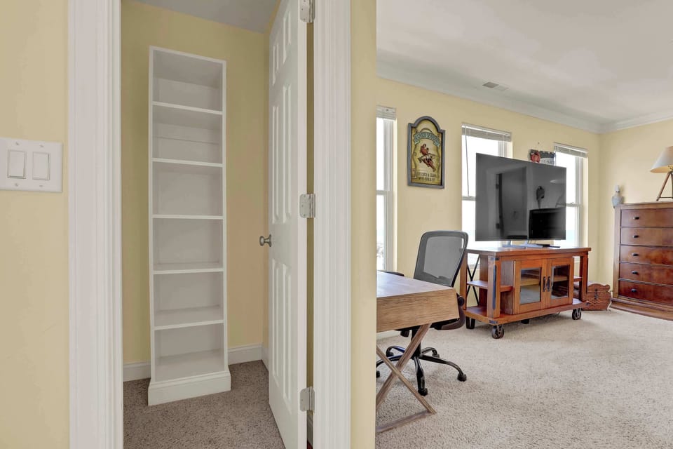 This thoughtfully designed space offers storage.