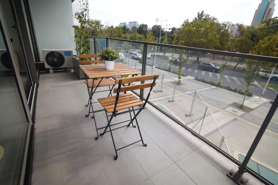 Relax on your private balcony with a view of the cityscape, perfect for morning coffee or evening relaxation.