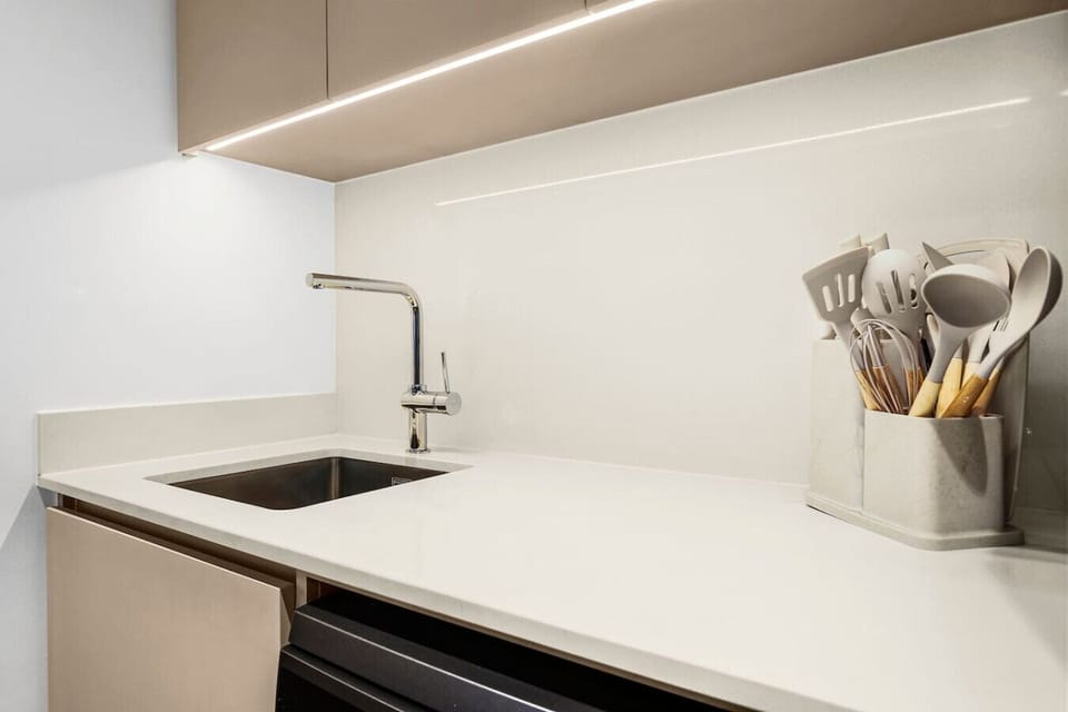 Modern Kitchen: Whip up culinary delights in this sleek, fully-equipped kitchen with stylish decor!