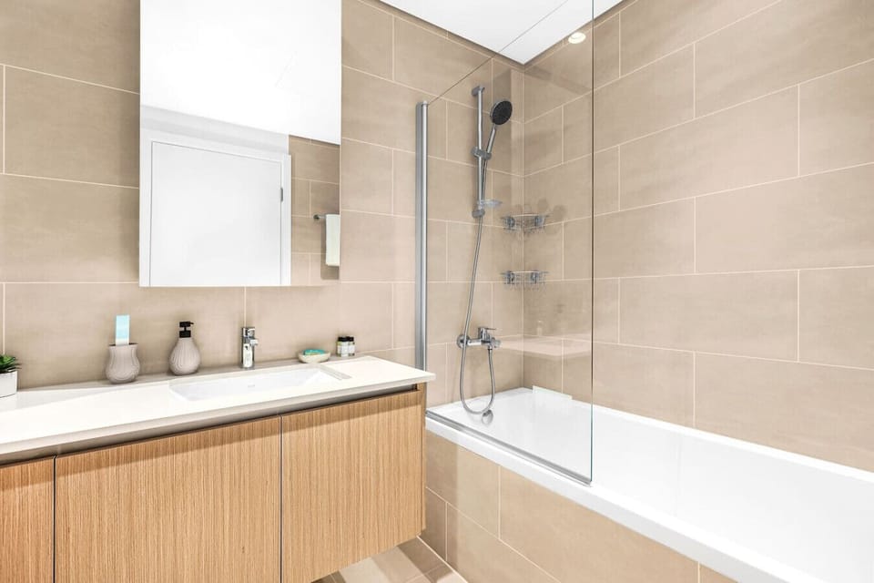 Modern Bathroom: Elegant finishes and sleek fixtures for a refreshing retreat after your adventures!
