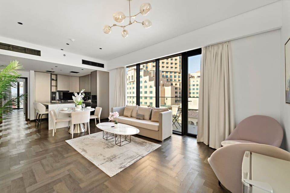 Living Room: Sunlit elegance with chic décor and stunning city views awaits your relaxation!