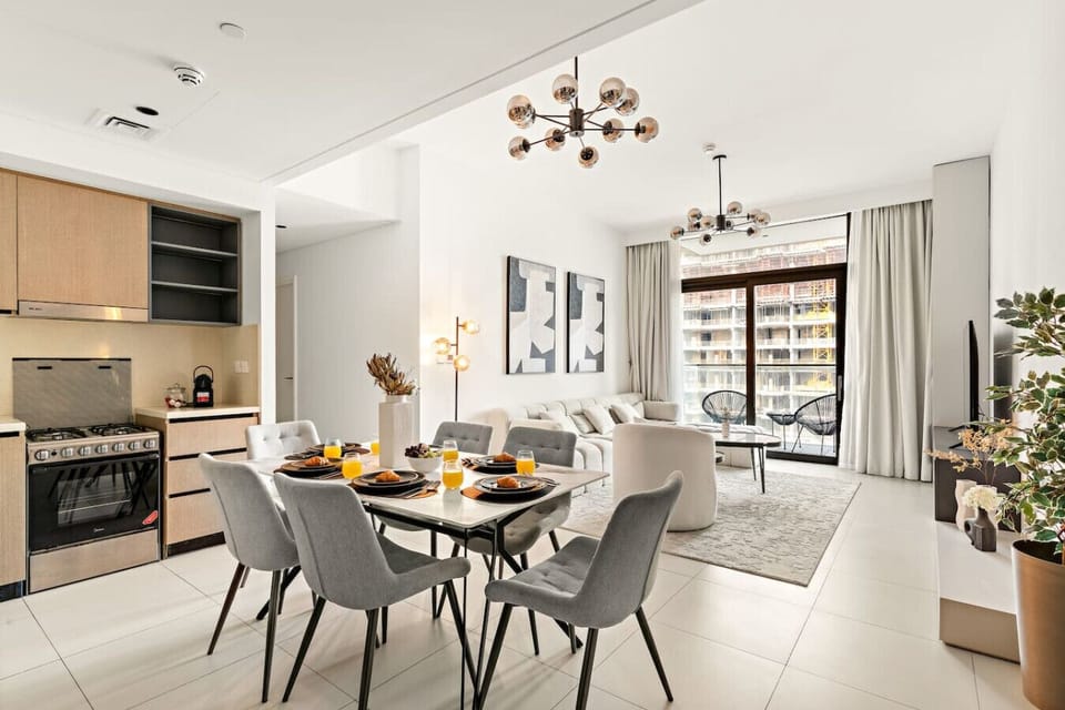Living Room & Dining Area: Stylish space with modern decor and abundant natural light awaits you!