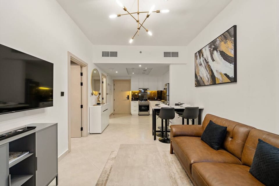 Living Room: Open concept with sleek décor, sunlight, and a perfect spot to unwind after adventures!