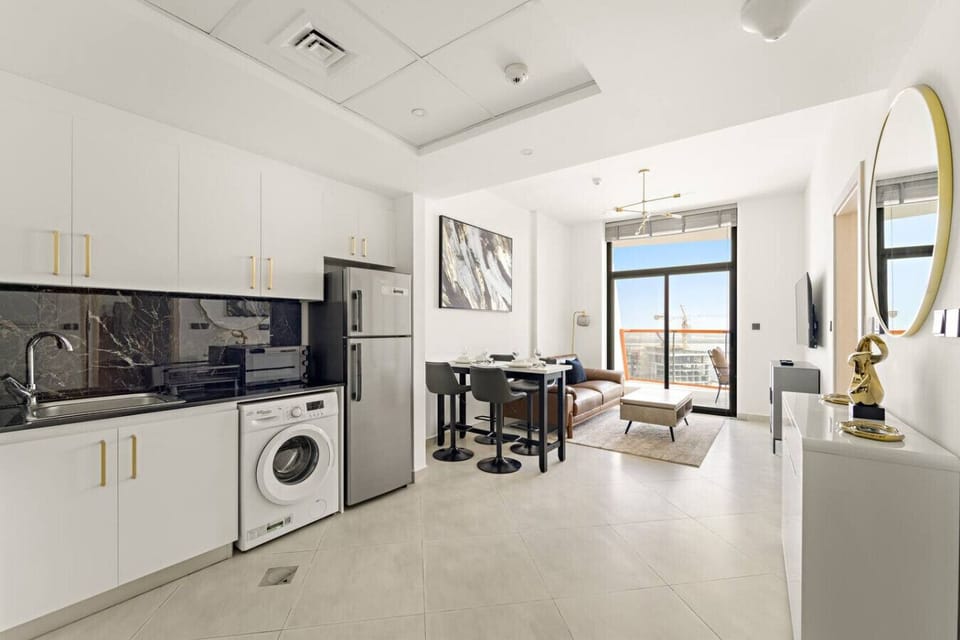 Dining and Living Area: Stylish space with modern furniture and stunning city views awaits you!