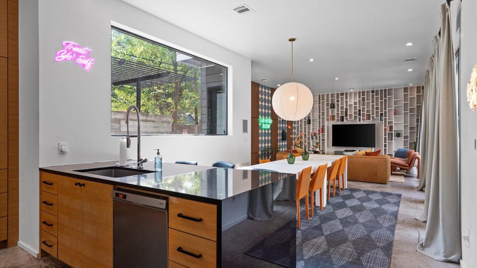 Stylish & Fully Equipped Kitchen - A sleek, contemporary kitchen with bar seating designed for both short stays and longer visits.