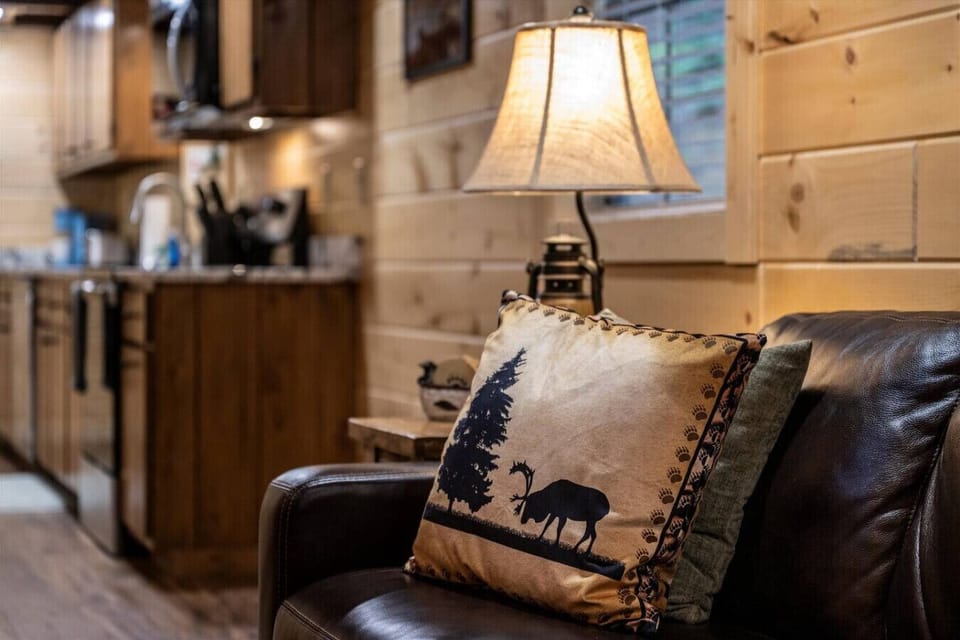 The cabin’s decor blends natural textures and cozy lighting, creating a relaxing retreat after a day of adventures.