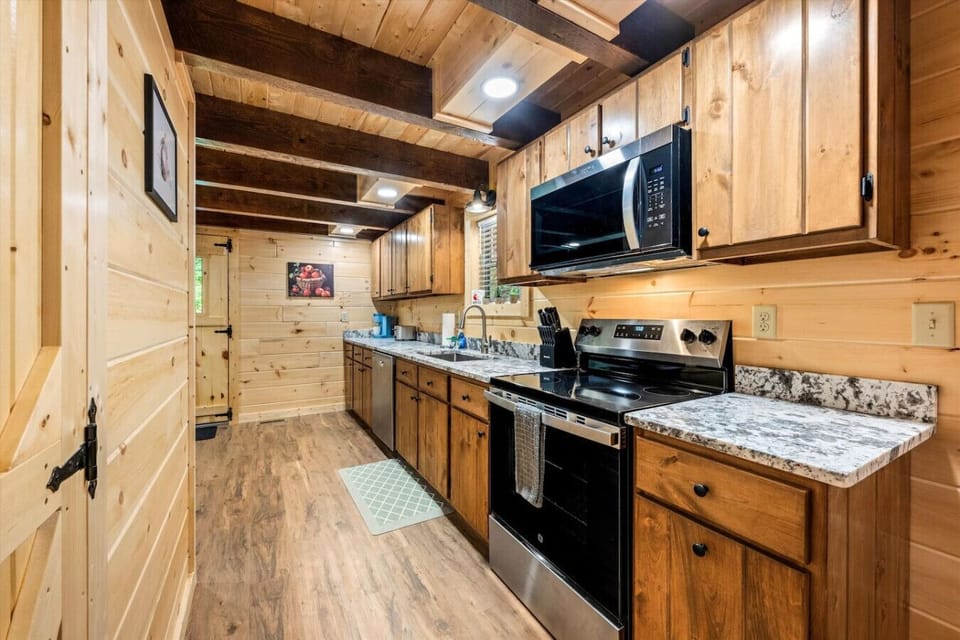 The kitchen offers a seamless layout with everything you need to prepare a hearty breakfast or a relaxing dinner after a day of exploring.