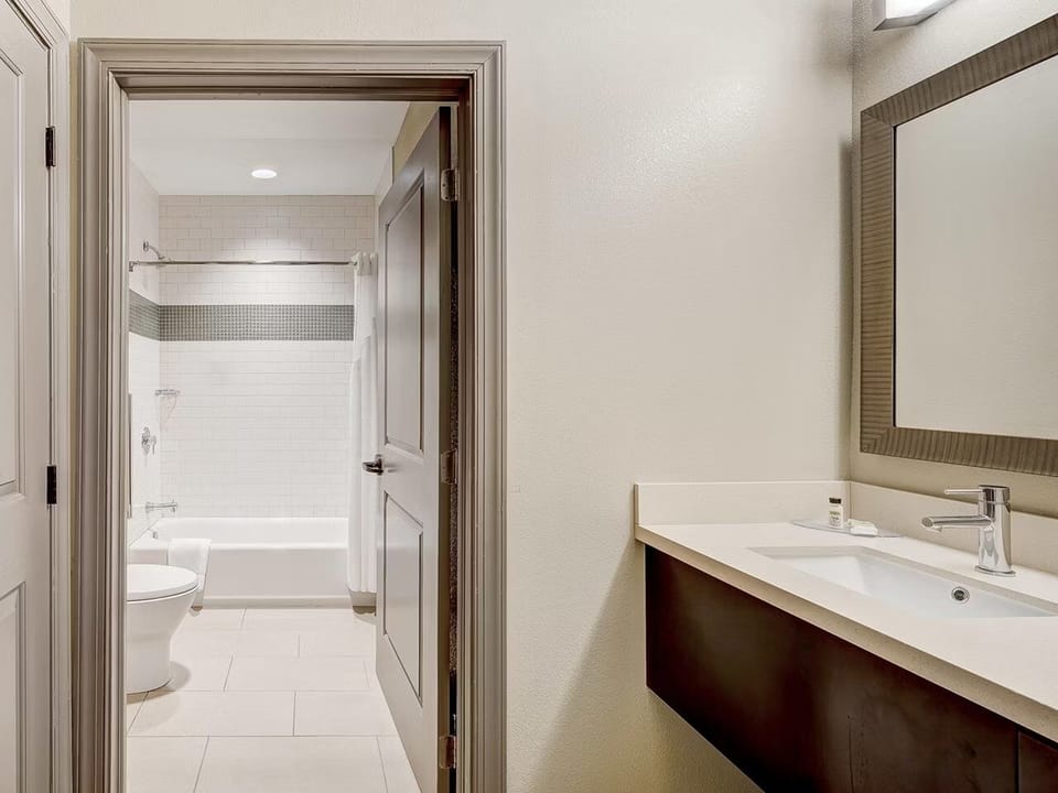Get ready effortlessly with expansive counter space and mirror.