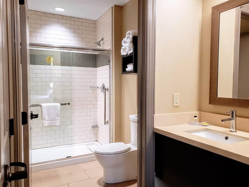 Refresh in a bright bathroom with spacious vanity and shower.