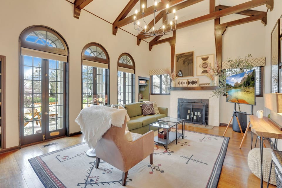 Enjoy a living room flooded with natural light from the trio of french doors.