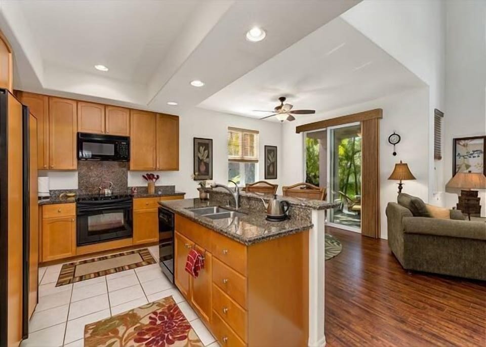 Stylish kitchen with granite countertops, modern appliances, and open flow into the living space.