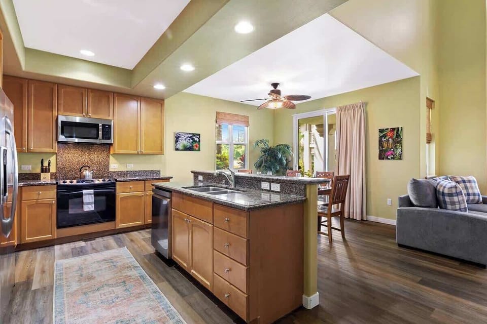 Chef it up in this fully stocked kitchen with granite counters, stainless appliances, and tropical views.