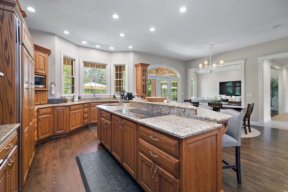 Open concept layout is great for entertaining large groups. For those cooking at the induction cooktop there are chef mats to keep you comfortable and a good view of the TV so you don't miss anything!