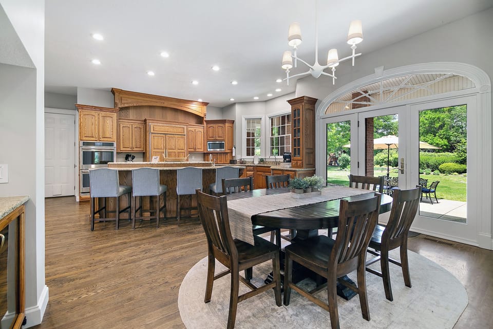 Great kitchen for entertaining with island counter seating and dining table