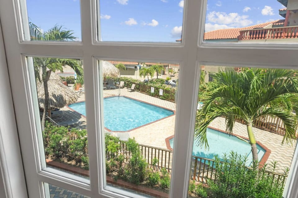 Two of the three community pools, shallow kids pool included