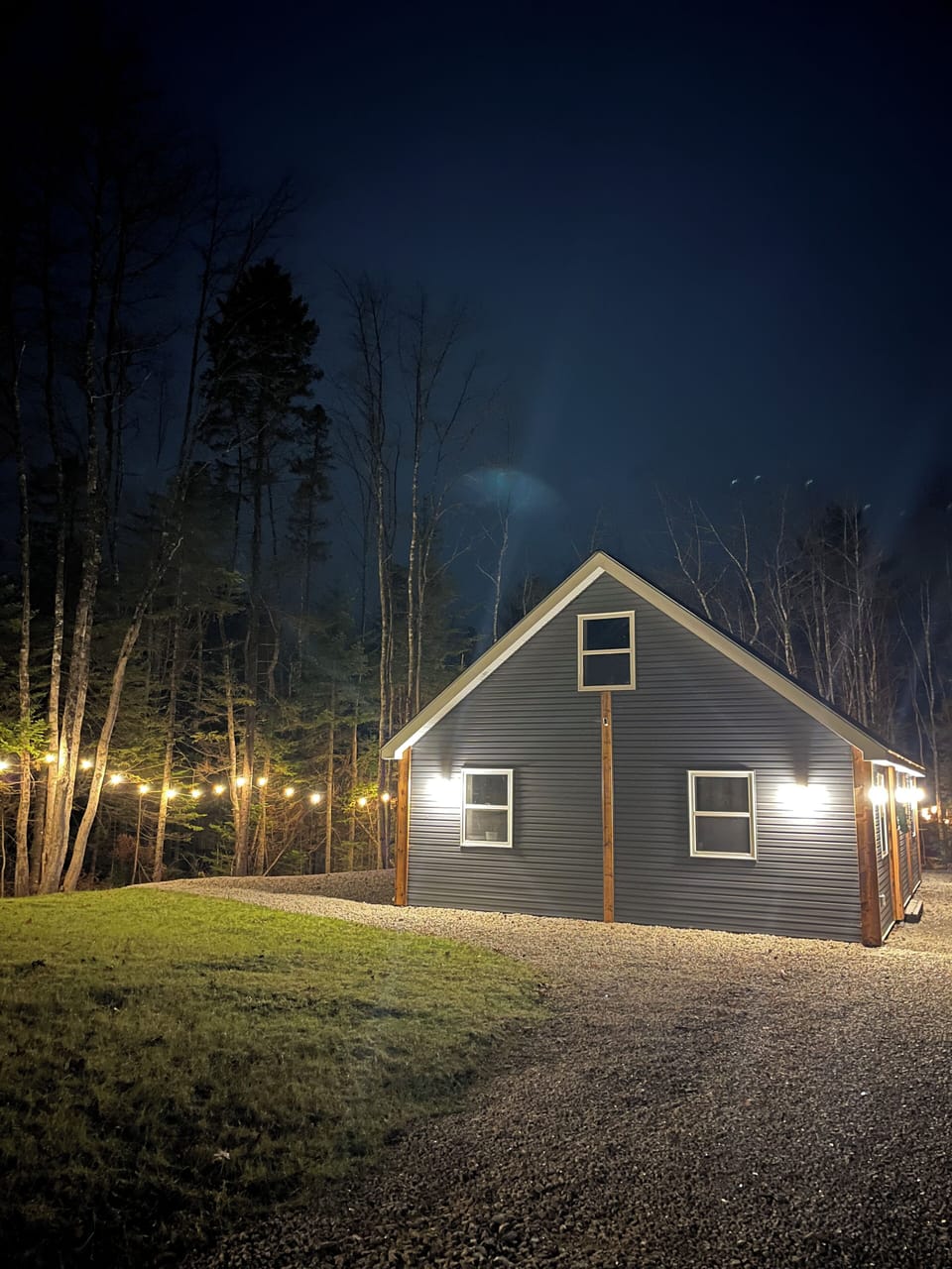 The house is well lit for security and ambiance.
