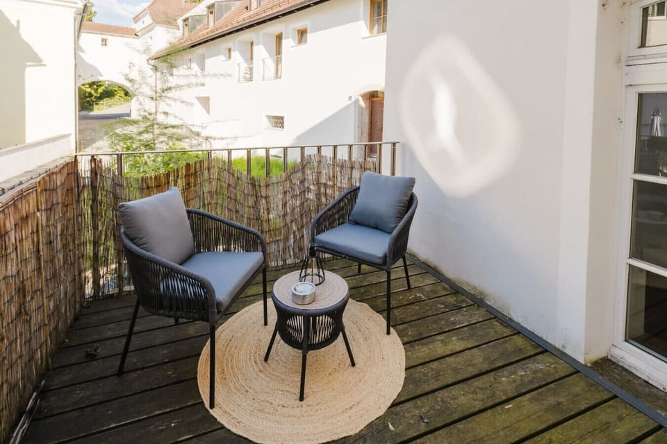 Charming balcony with comfortable seating — perfect for enjoying fresh air and a quiet moment.