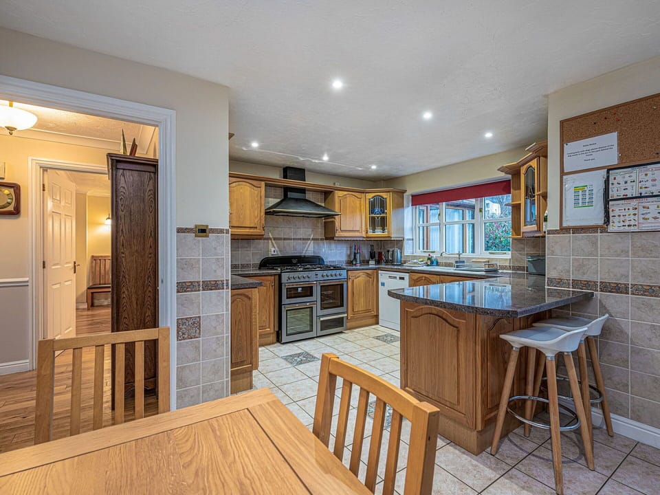 Kitchen, Furniture, Flooring, Interior Design, Countertop, Floor, Wood, Cabinetry, Ceiling, Kitchen Appliance