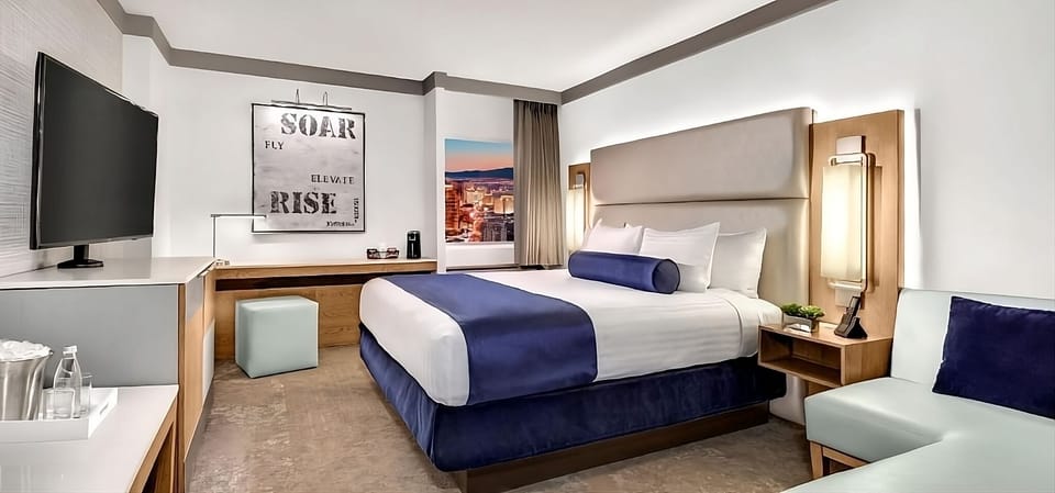 Sink into plush king-bed comfort in a calming, modern room.