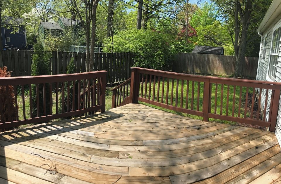 Deck has 2 seats and privacy fence 