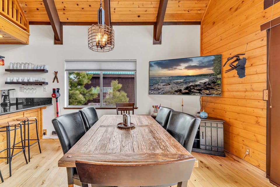 Dining area: Main floor, table seating for 6, bar seating for 4, outdoor deck access
