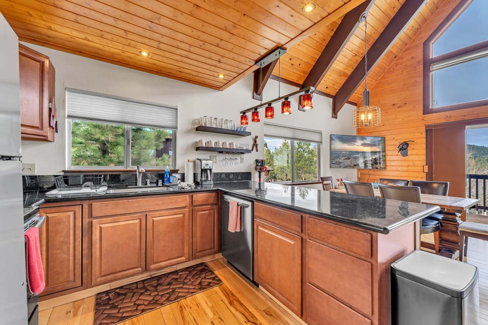 Kitchen: Main floor, drip coffee maker, toaster oven, Crockpot, waffle maker, cooking utensils, tableware