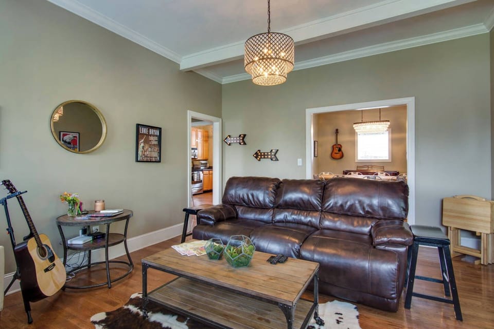 Super comfy and spacious living room with reclining sofa and internet-connected TV