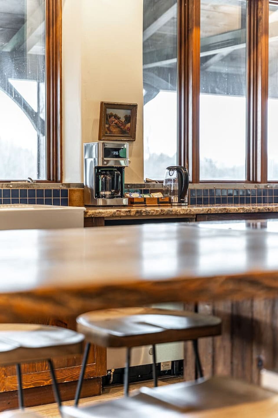 Fully equipped kitchen with large island, premium appliances, and seating for 20+ — great for group meals and events.